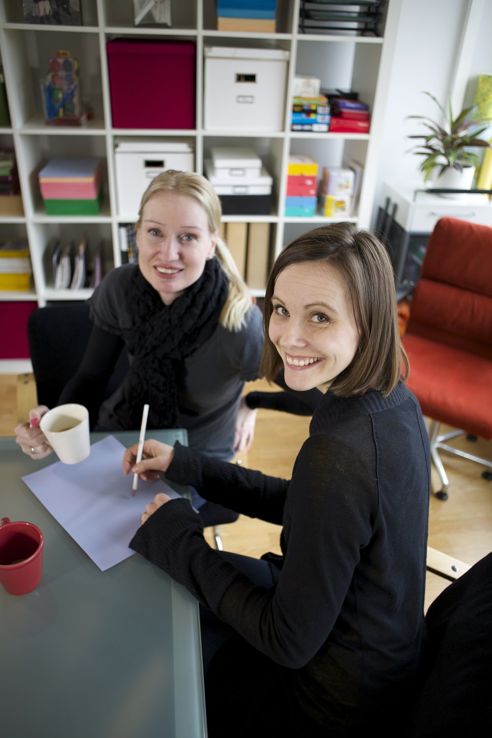 Two speech-language pathologists at a table